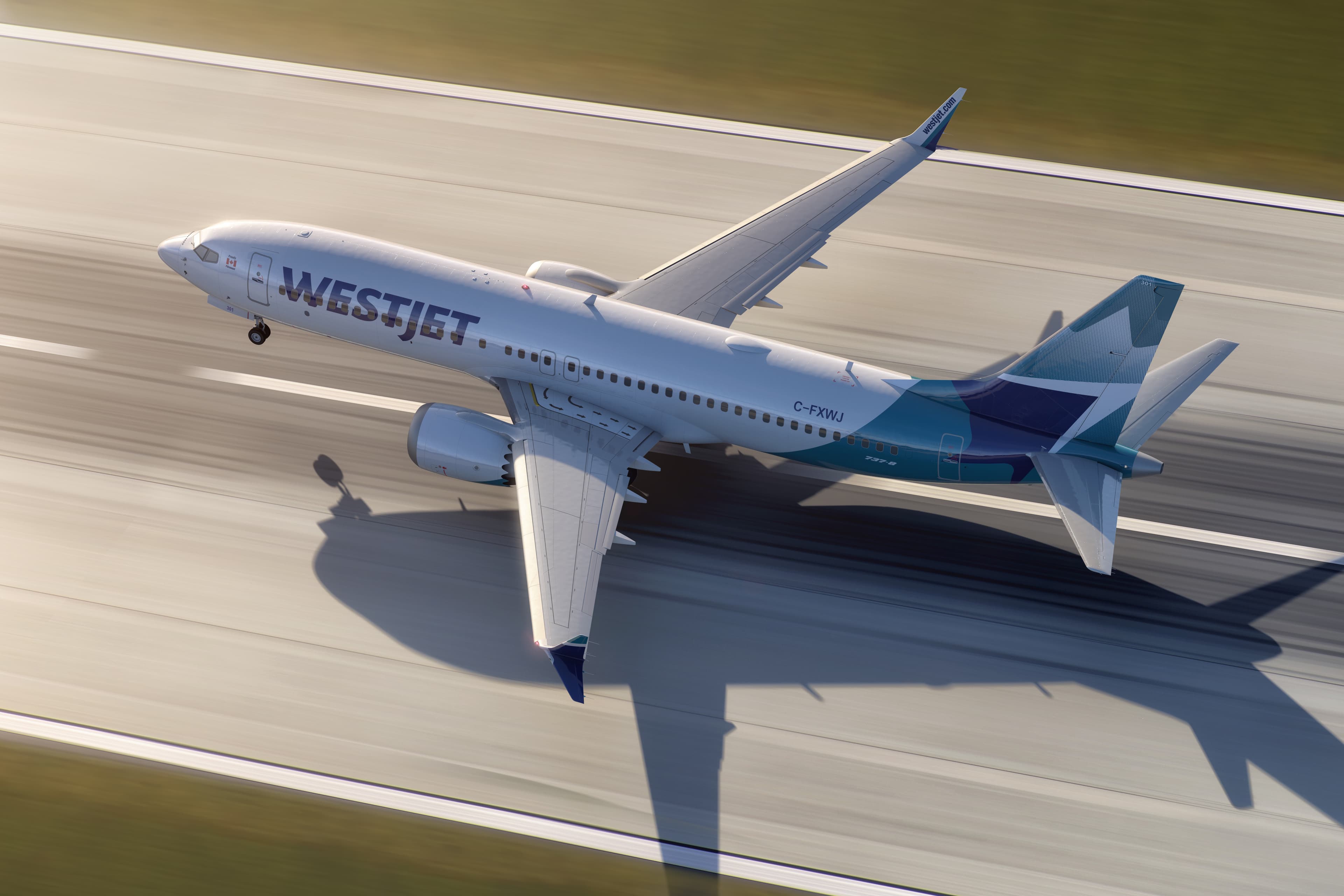 WestJet Boeing 737-8 taking off, seen from above beside a runway.