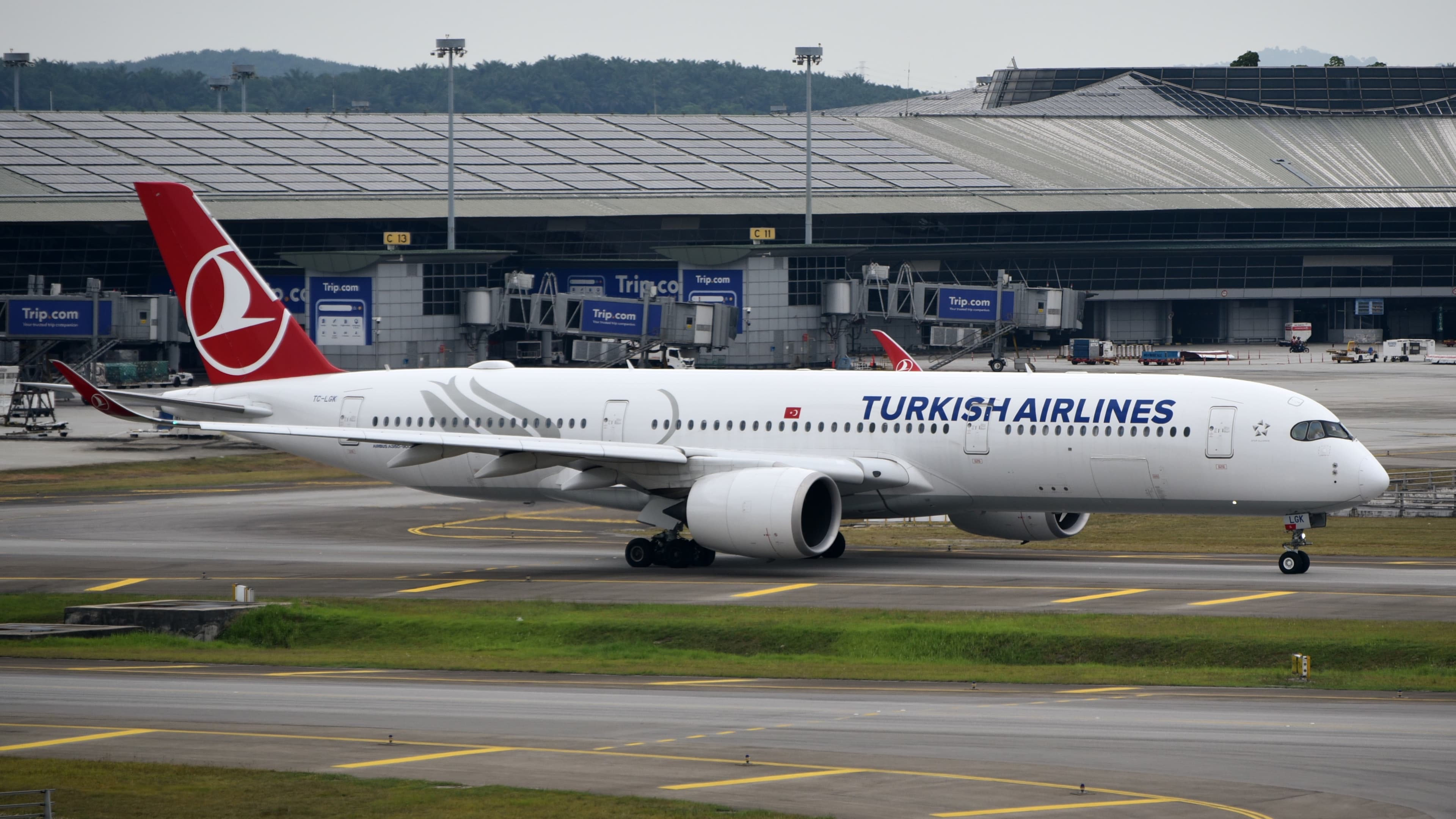 Turkish Airlines Airbus A350-941, registration TC-LGK, taxiing in front of the terminal at Kuala Lumpur Airport