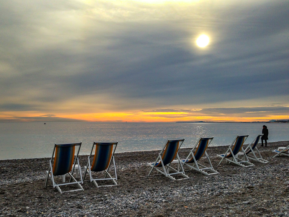 Sunset on the pebble beach of Nice