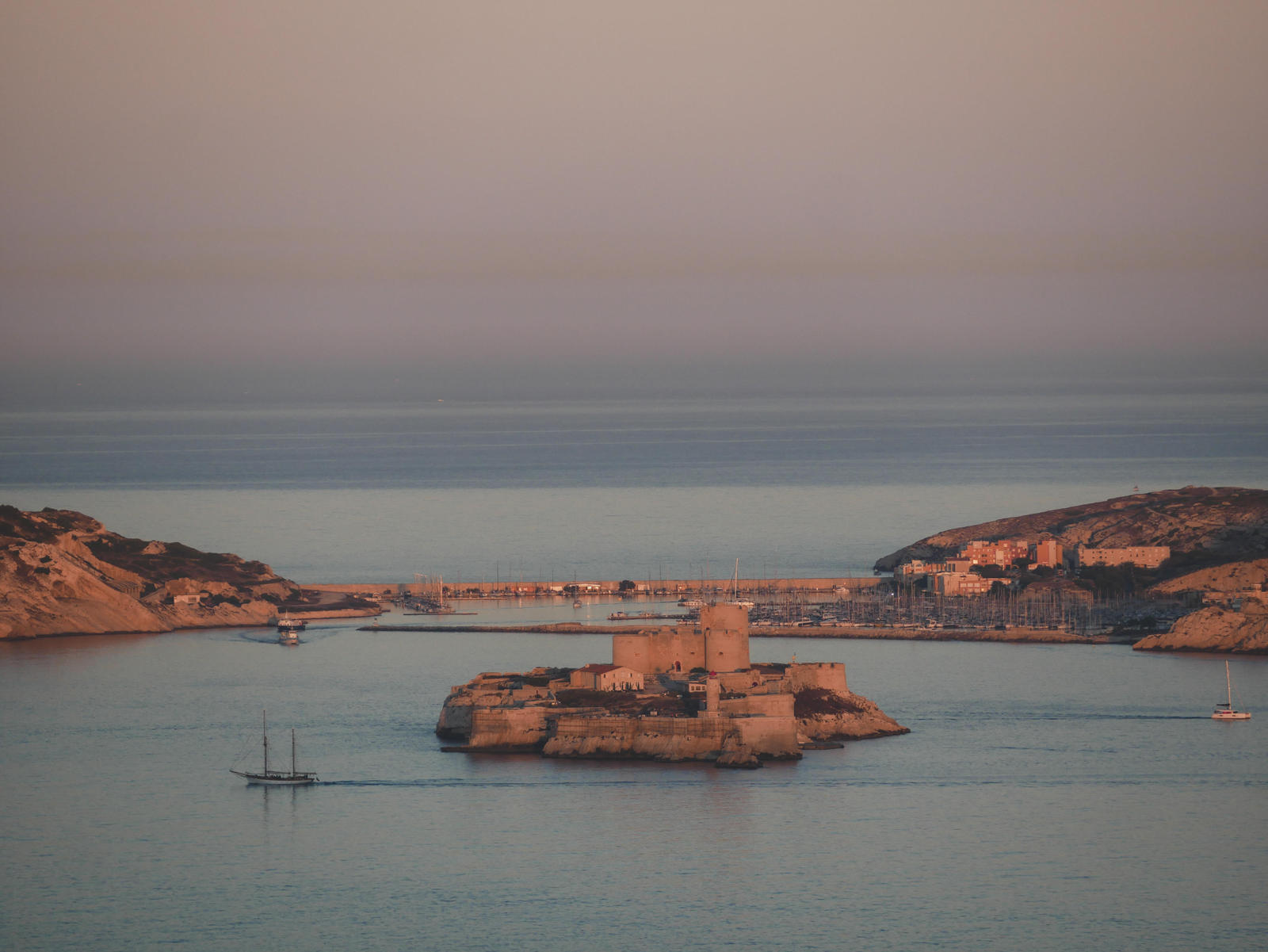 France: French Riviera Travel Guide | Itineraries and Highlights - End Of Day In The Calanques To The Chateau D'If. Credit Gensollen C
