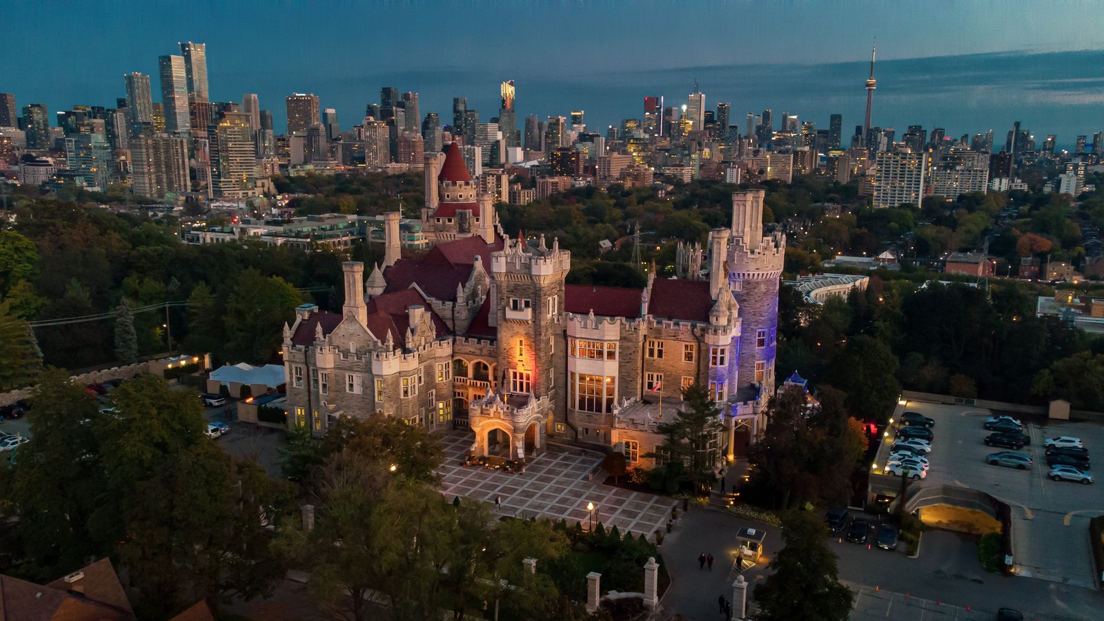 Travel Guide: What to Do on a Short Stay in Toronto - Casa Loma Ariel Drone City Skyline Cn Tower Night Attractions Image
