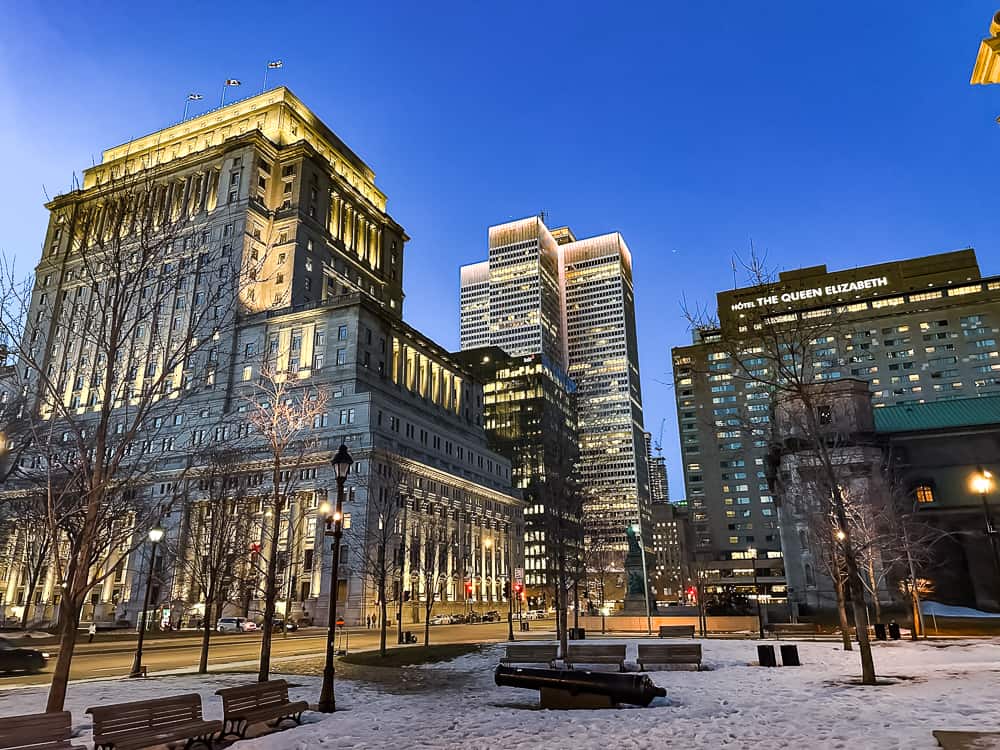 Spectacular night view of downtown Montreal with the illuminated Fairmont the Queen Elizabeth in the foreground