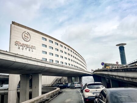 Modern architectural facade of the Sheraton Paris CDG integrated into the Charles de Gaulle airport infrastructure