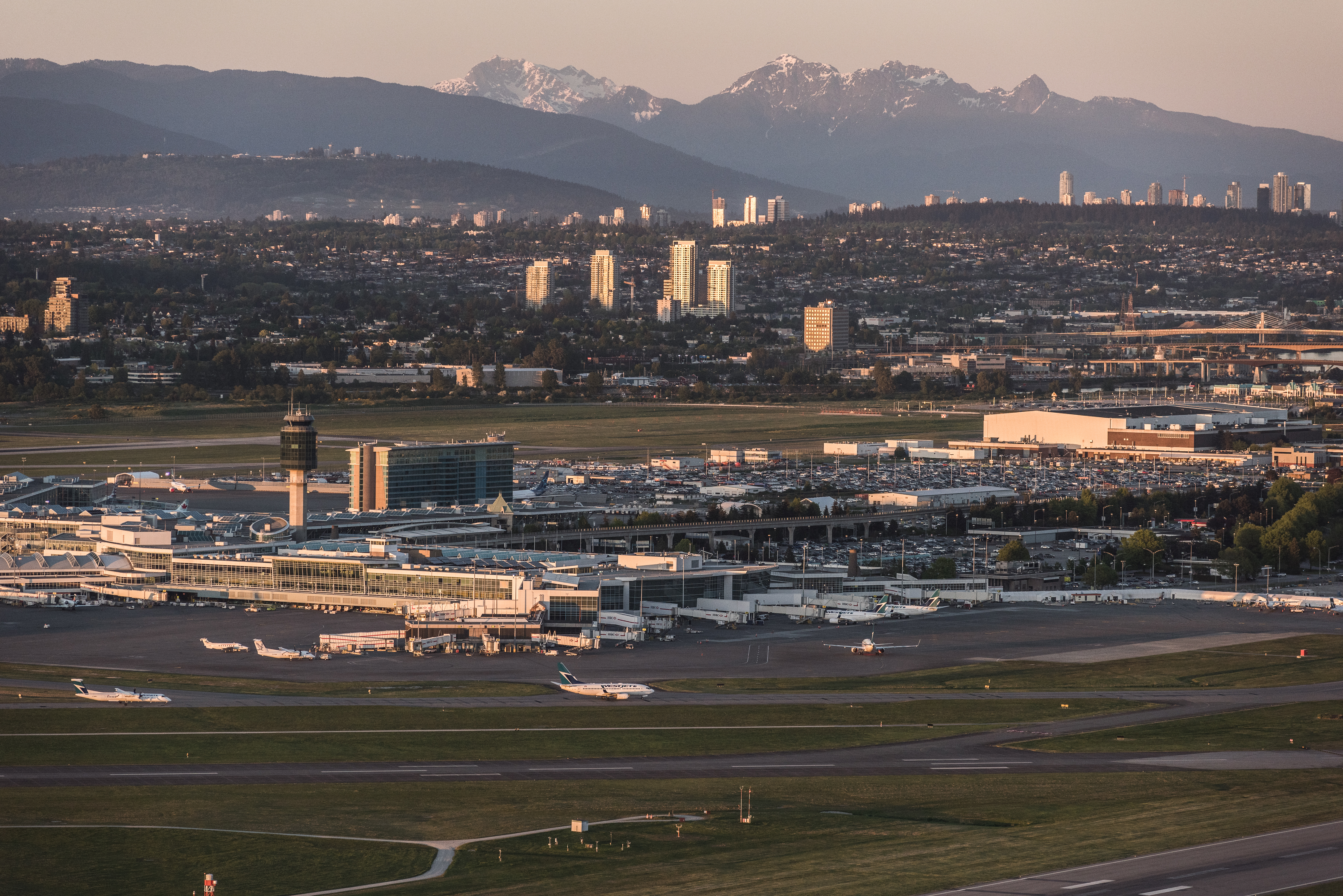 Ultimate Guide to YVR Vancouver International Airport - YVR Guide airport runway with mountain