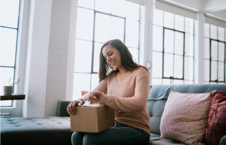 amazon shop with points – woman opening box