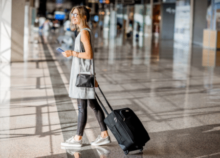 Amex Fixed Points - woman with luggage in airprot