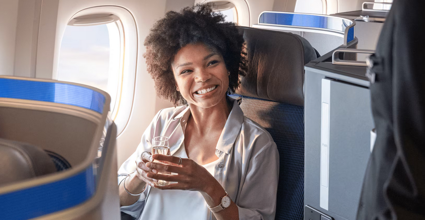 woman in United business class seat