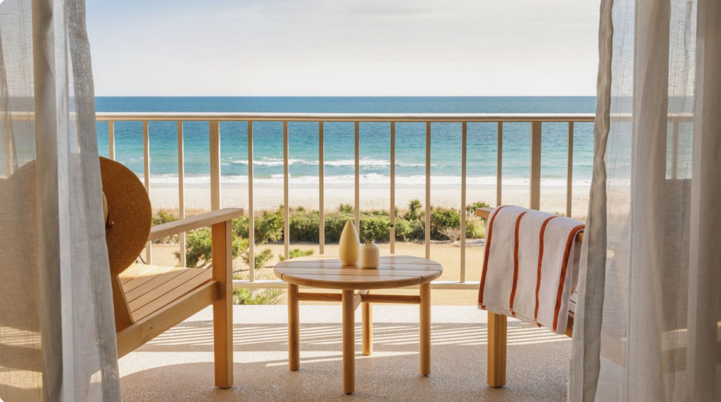 Marriott Gift Cards - feature image - chairs on balcony overlooking beach and ocean