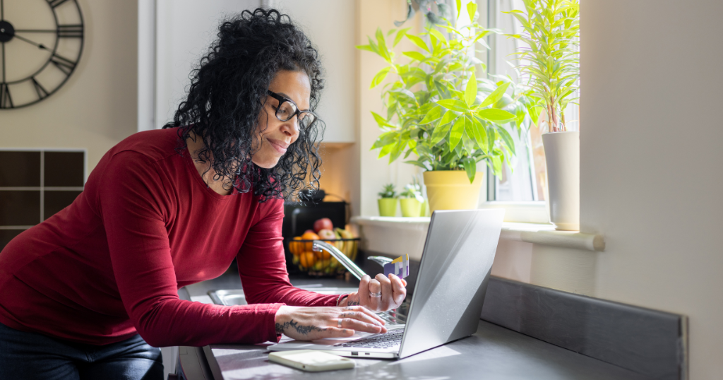 Woman paying bills on her laptop