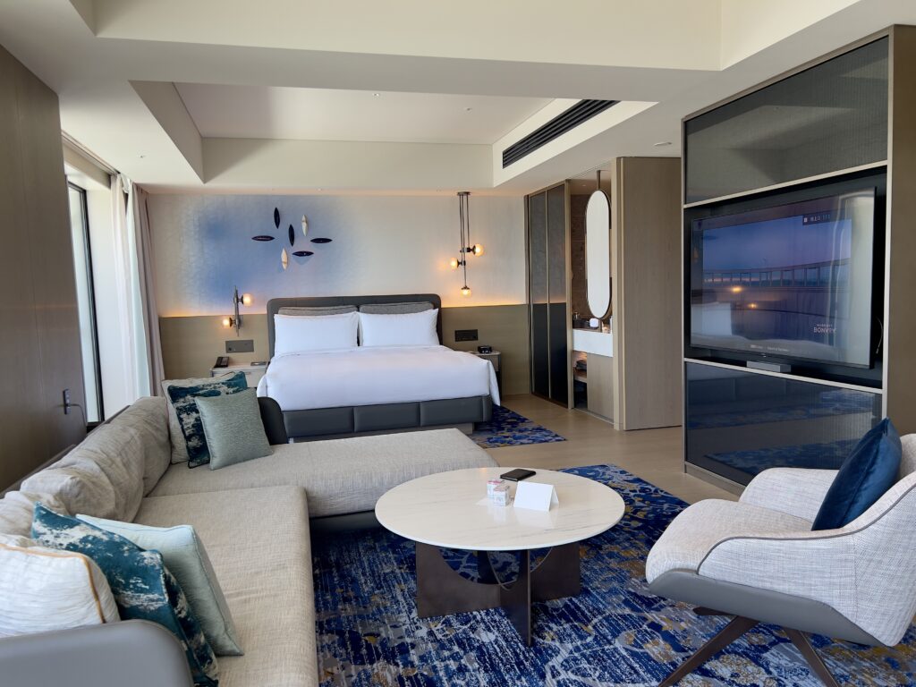 Spacious suite at the Marriott Nagasaki with lounge, separate bedroom, and panoramic view of Nagasaki Bay