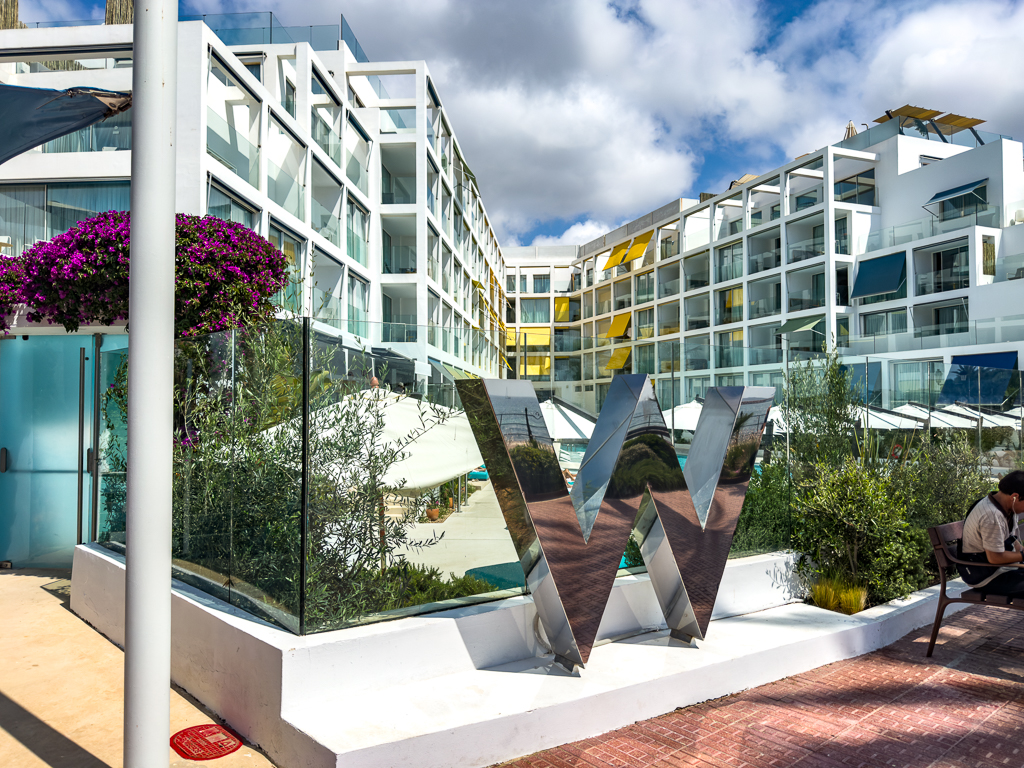 Modern architecture of the w ibiza with a geometric white facade and the iconic W logo in the centre