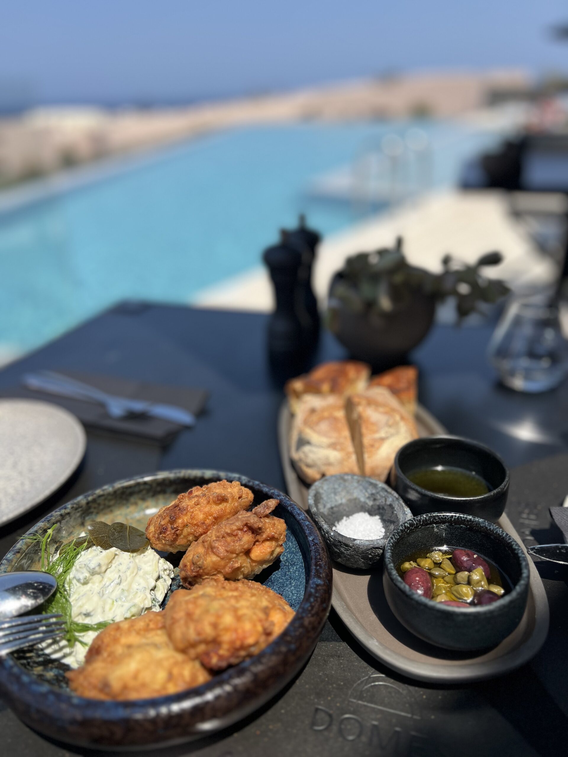 Greek appetizers and olives served poolside