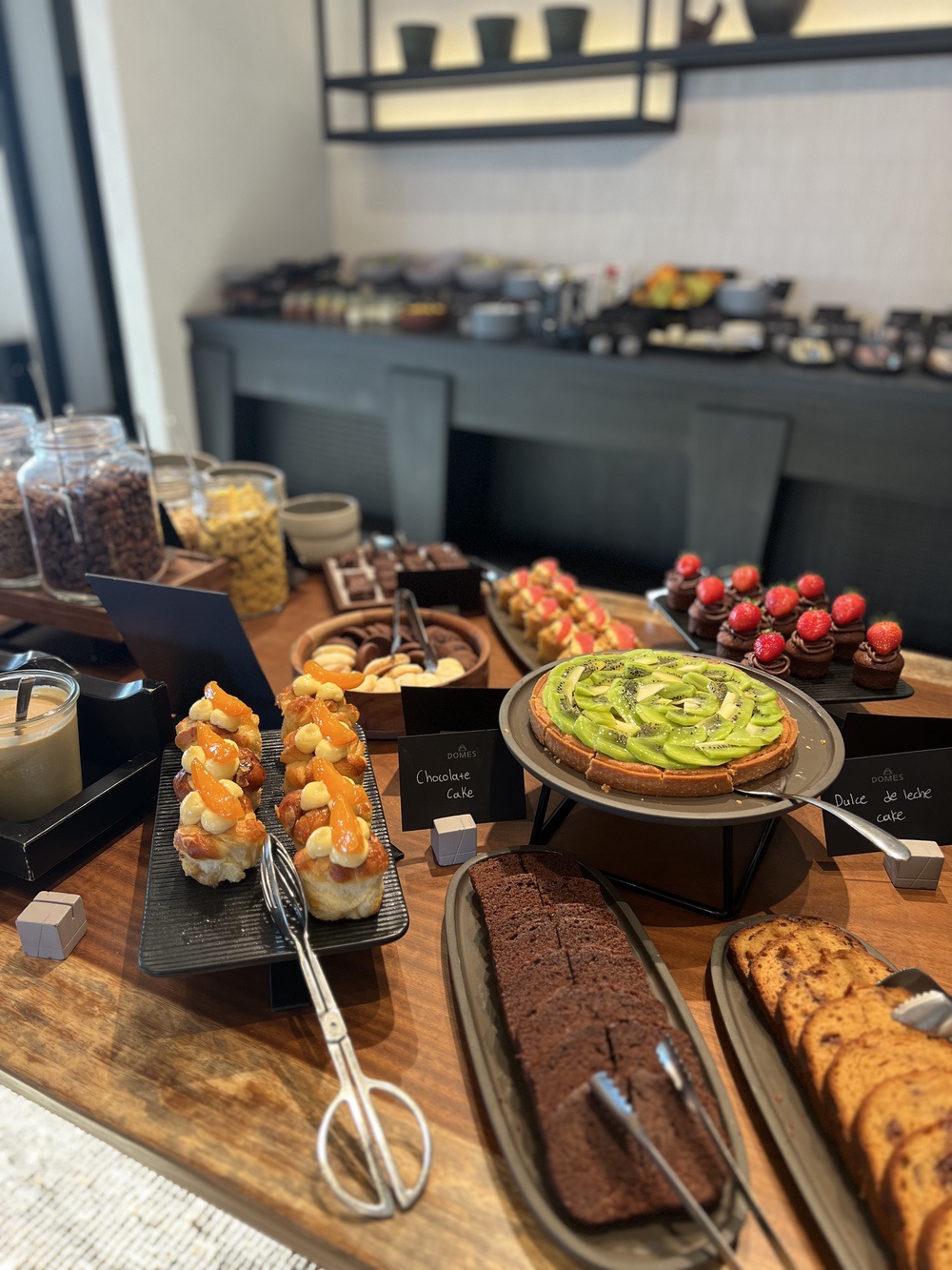 Pastry and cake buffet at breakfast at Domes Novos Santorini