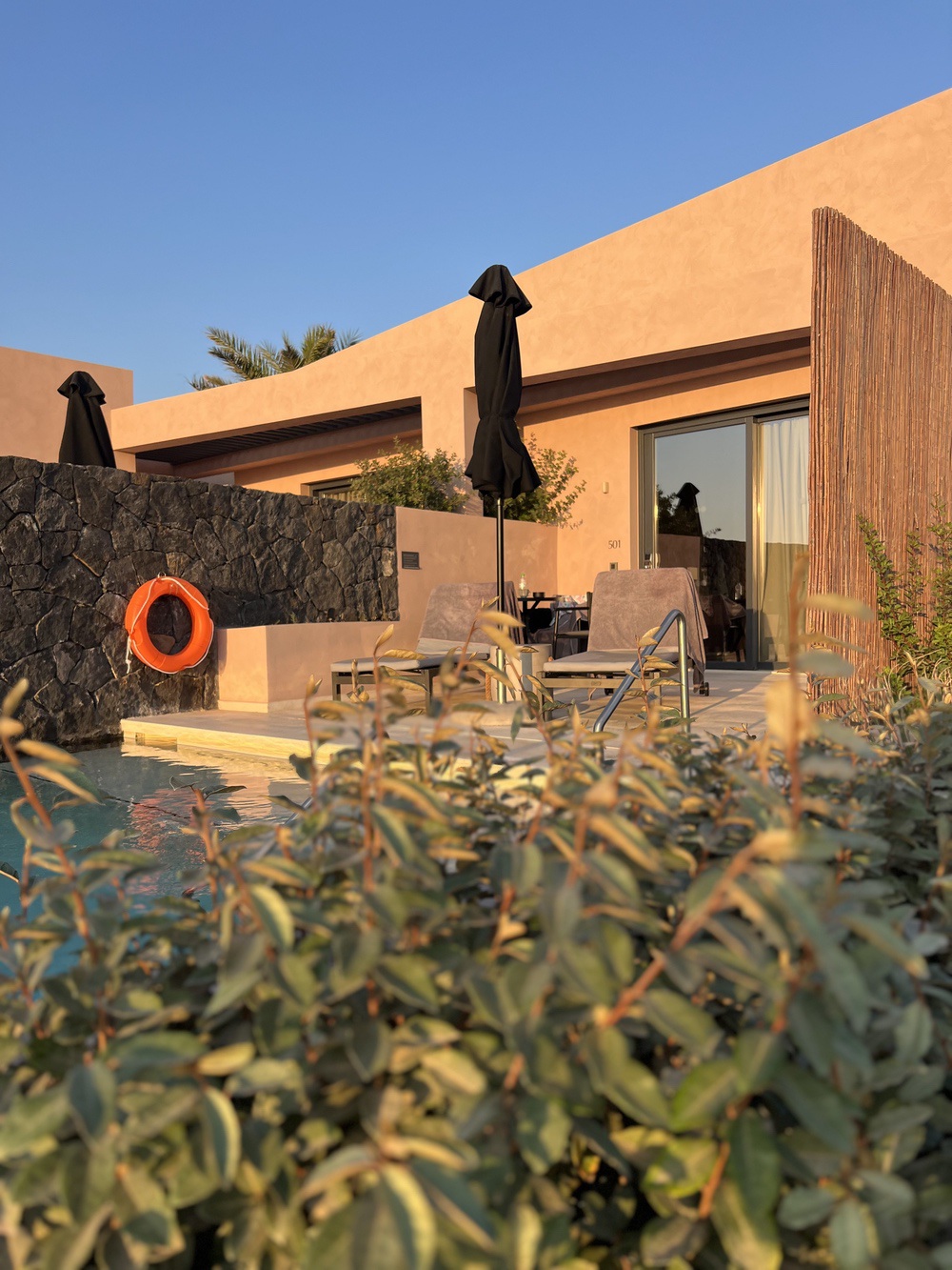 Private bungalow terrace at sunset, Domes Novos Santorini