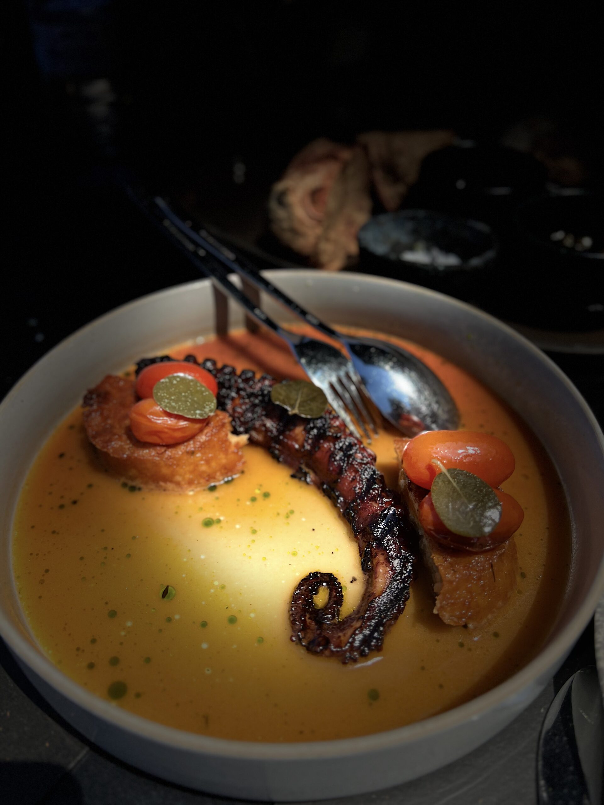 Grilled octopus and sauce in modern Greek gastronomy
