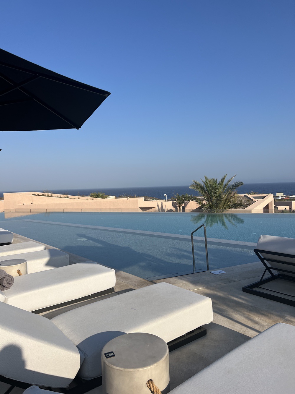 Main infinity pool with sea view at Domes Novos Santorini