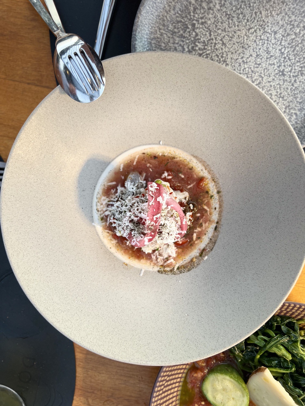 Refined appetizer served at the rooftop restaurant of Domes Novos Santorini
