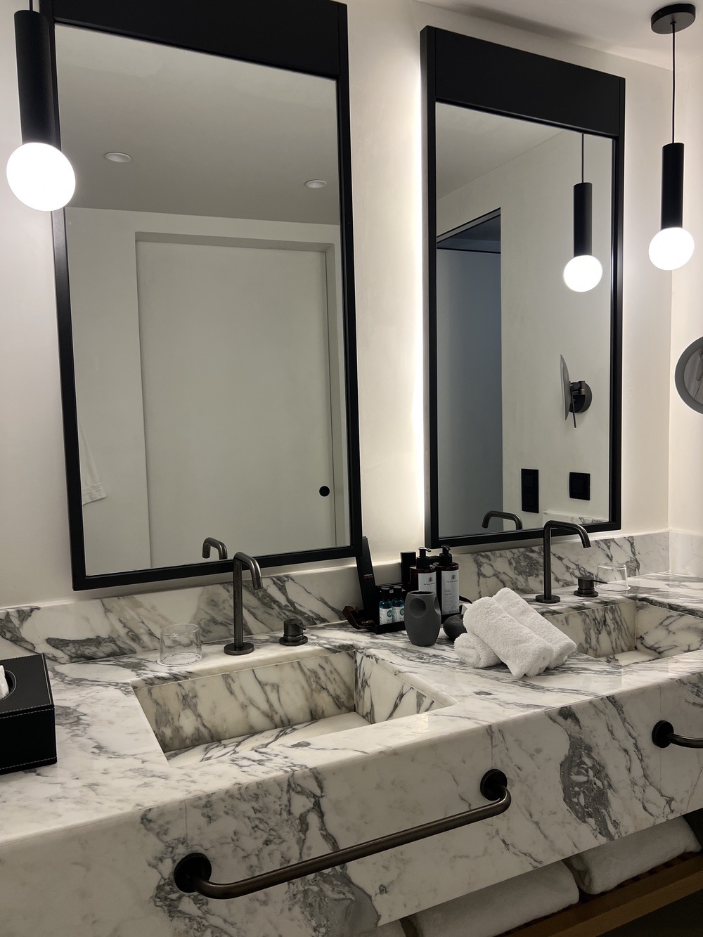 Marble bathroom with double vanity at Domes Novos Santorini