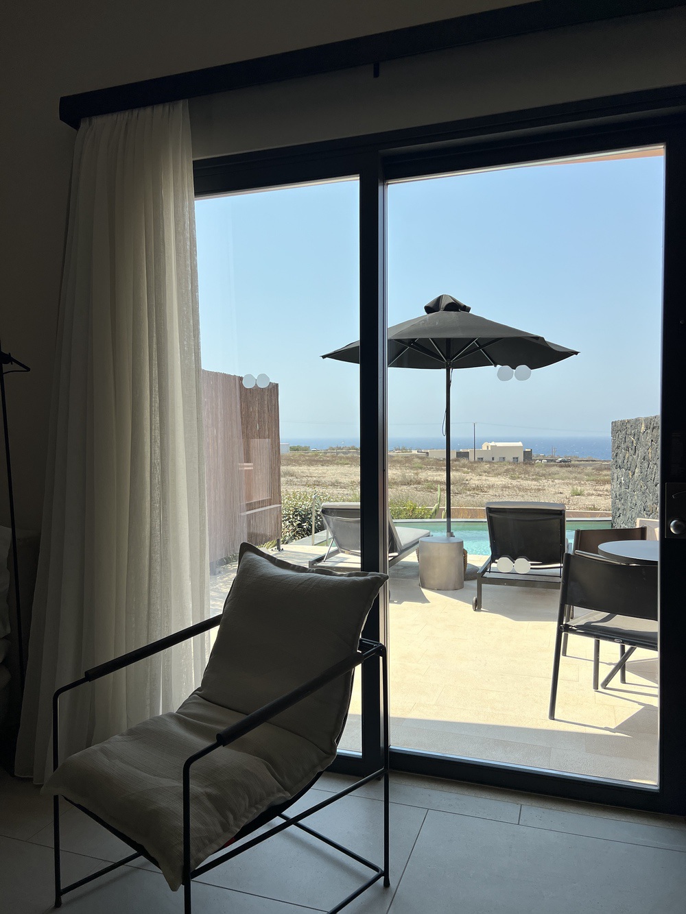 Access from the room to the private terrace with pool and sea view