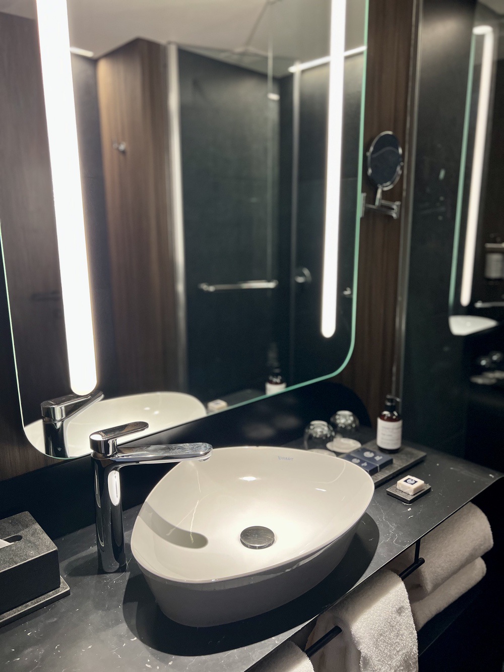 Elegant bathroom with Duravit sink and illuminated mirror