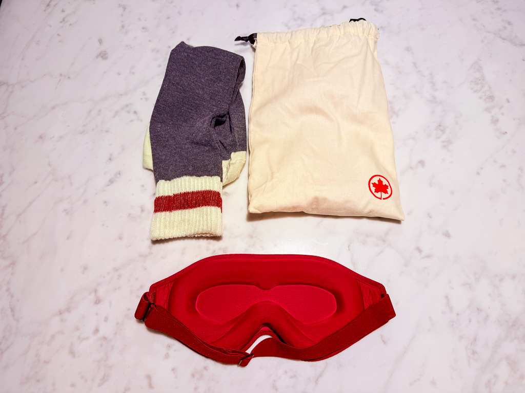 Air Canada Signature Class wellness kit with striped socks and recycled cotton bag
