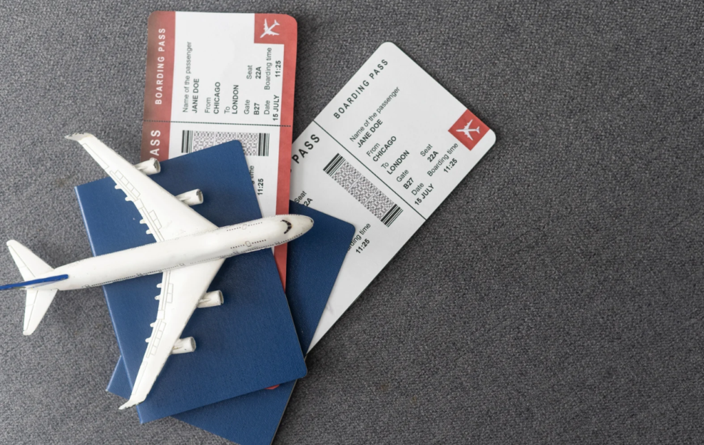 Toy plane on passports on plane tickets